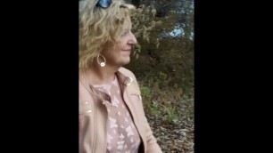 Caryl walking (flashing) in the woods